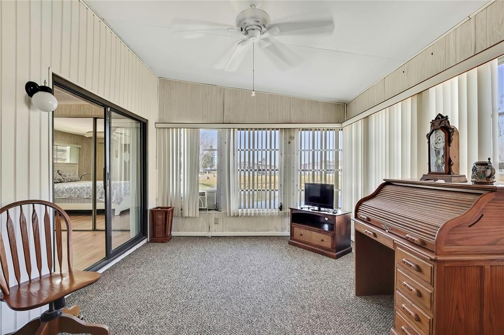 3141 Nantucket Drive Holiday, FL 34690 - Photo 20 of 34 a living room with furniture and a flat screen tv