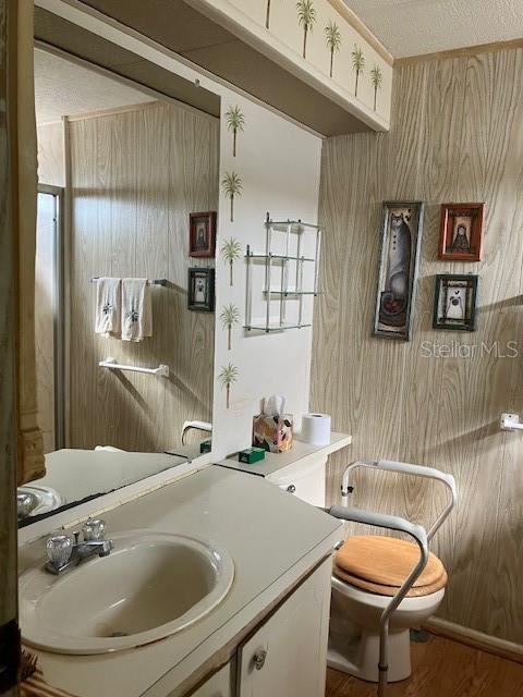 3141 Nantucket Drive Holiday, FL 34690 - Photo 21 of 29 a bathroom with a granite countertop sink a toilet a mirror and shower