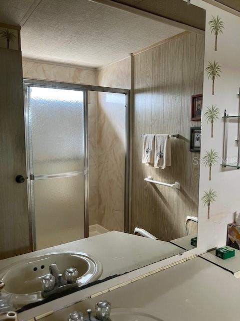 3141 Nantucket Drive Holiday, FL 34690 - Photo 23 of 29 a bathroom with a granite countertop sink and shower