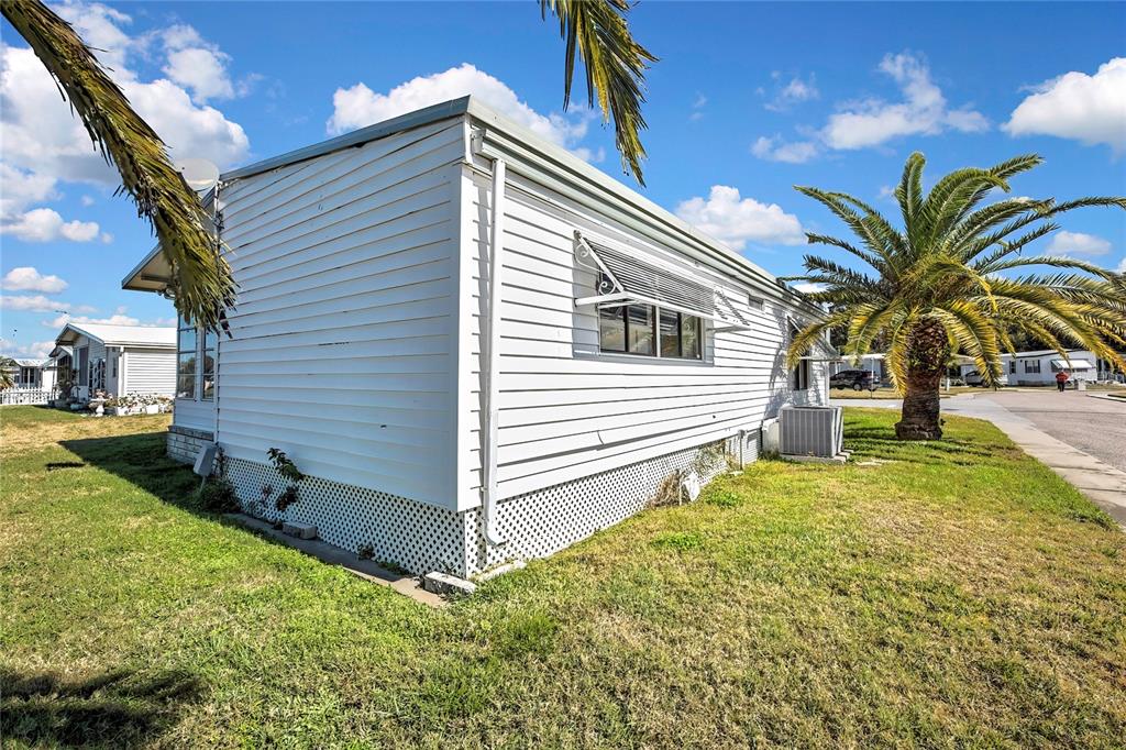 3141 Nantucket Drive Holiday, FL 34690 - Photo 26 of 34 a house view with a garden space