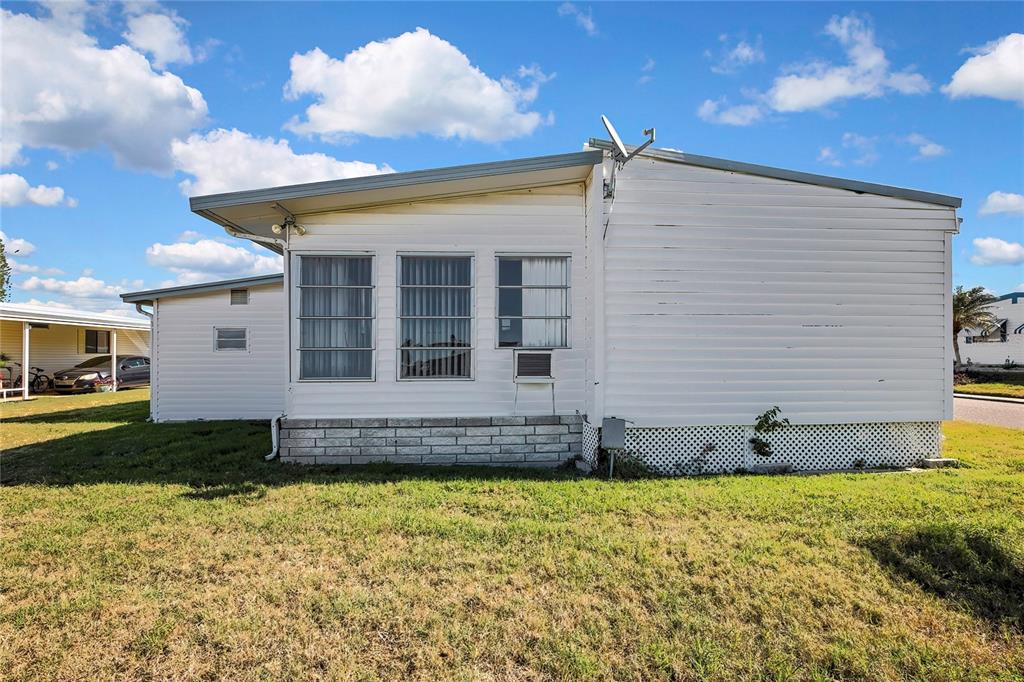 3141 Nantucket Drive Holiday, FL 34690 - Photo 27 of 34 a view of a house with a yard