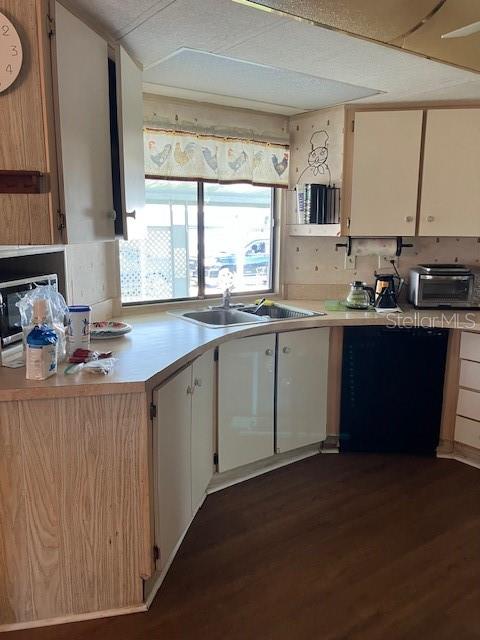 3141 Nantucket Drive Holiday, FL 34690 - Photo 9 of 29 a kitchen with a sink stove and cabinets