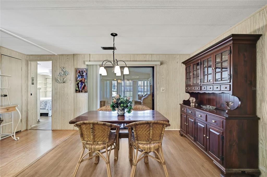 3141 Nantucket Drive Holiday, FL 34690 - Photo 9 of 34 a view of a dining room with furniture window and wooden floor