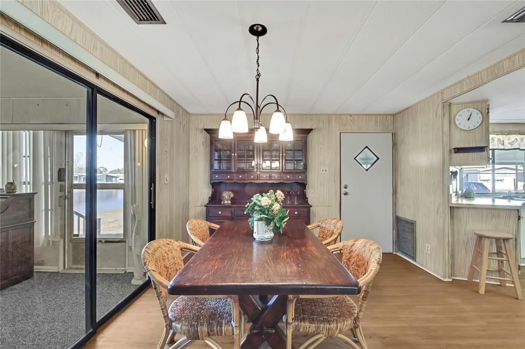 3141 Nantucket Drive Holiday, FL 34690 - Photo 10 of 34 a view of a dining room with furniture window and wooden floor