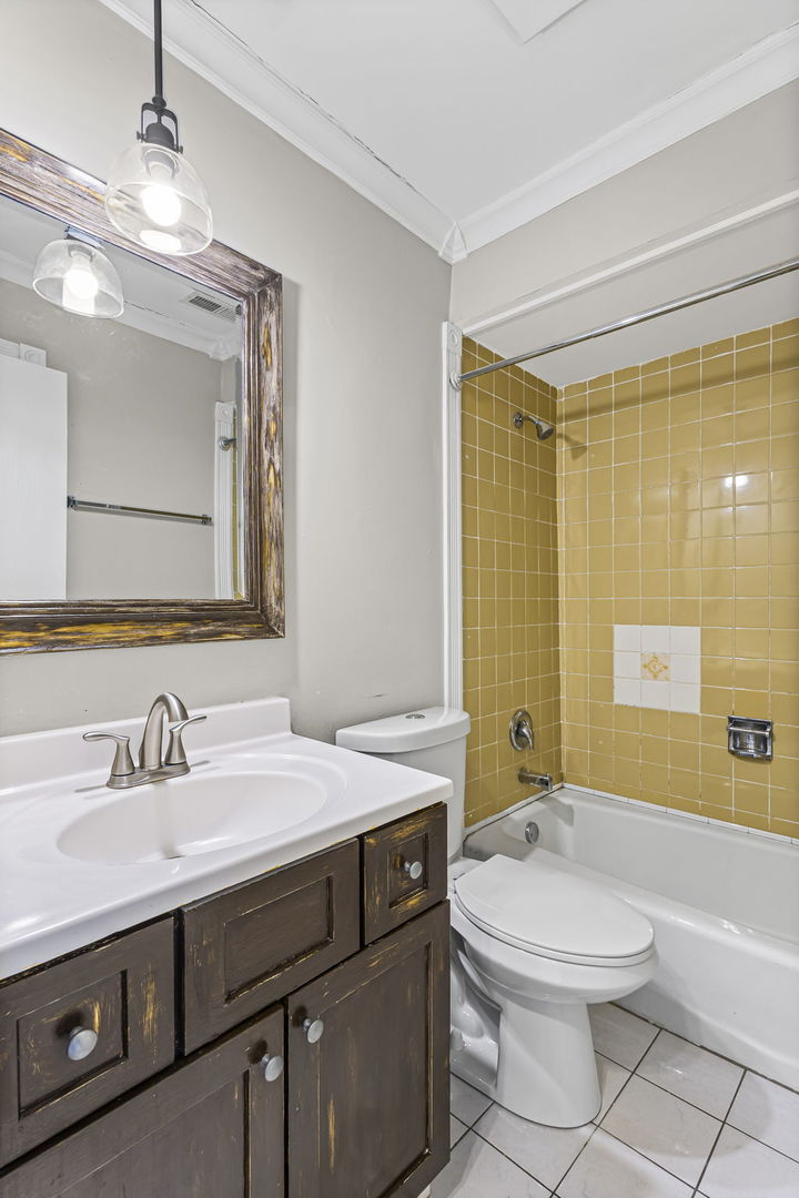 14457 Lamon Avenue, Unit 3N Midlothian, IL 60445 - Photo 14 of 21 a bathroom with a sink a toilet and shower
