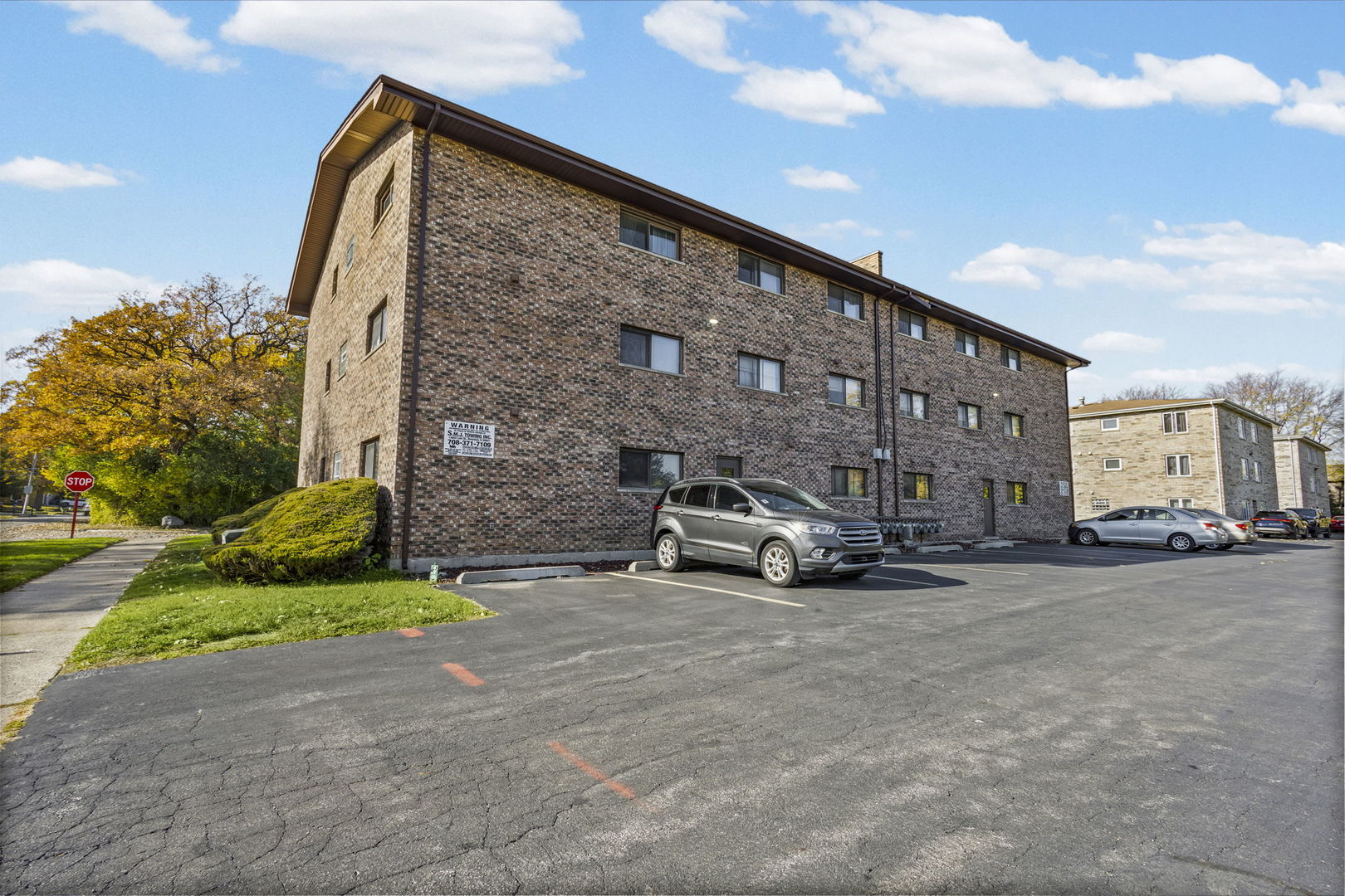 14457 Lamon Avenue, Unit 3N Midlothian, IL 60445 - Photo 3 of 21 a view of street with parked cars