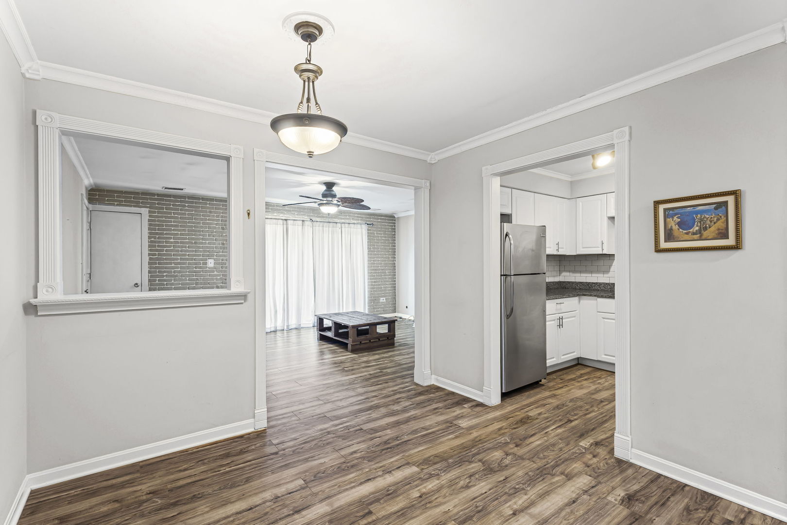 14457 Lamon Avenue, Unit 3N Midlothian, IL 60445 - Photo 8 of 21 a view of a hallway with wooden floor and a living room
