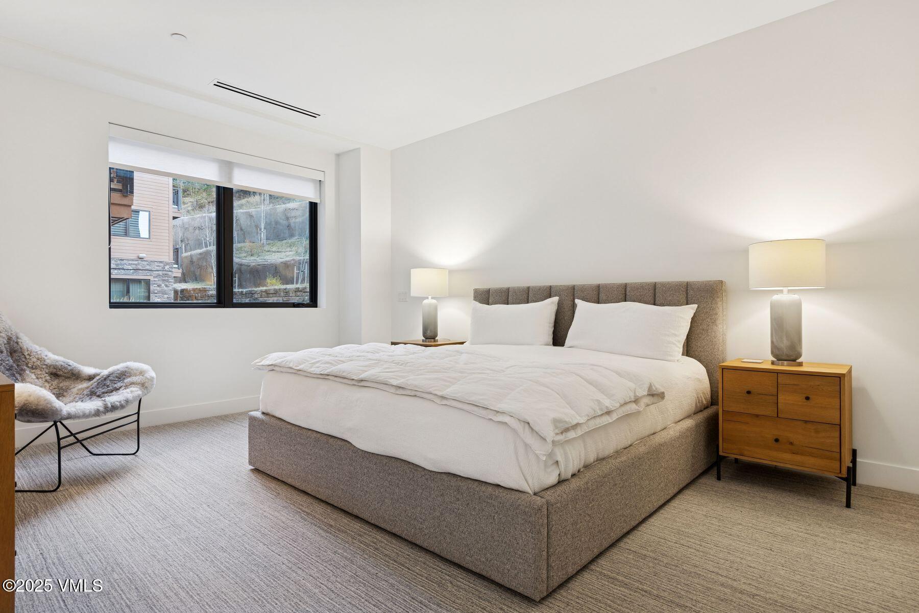 38460 Hwy 6 Avon Co 81620, Unit 205 Avon, CO 81620 - Photo 11 of 47 a bedroom with a bed and window