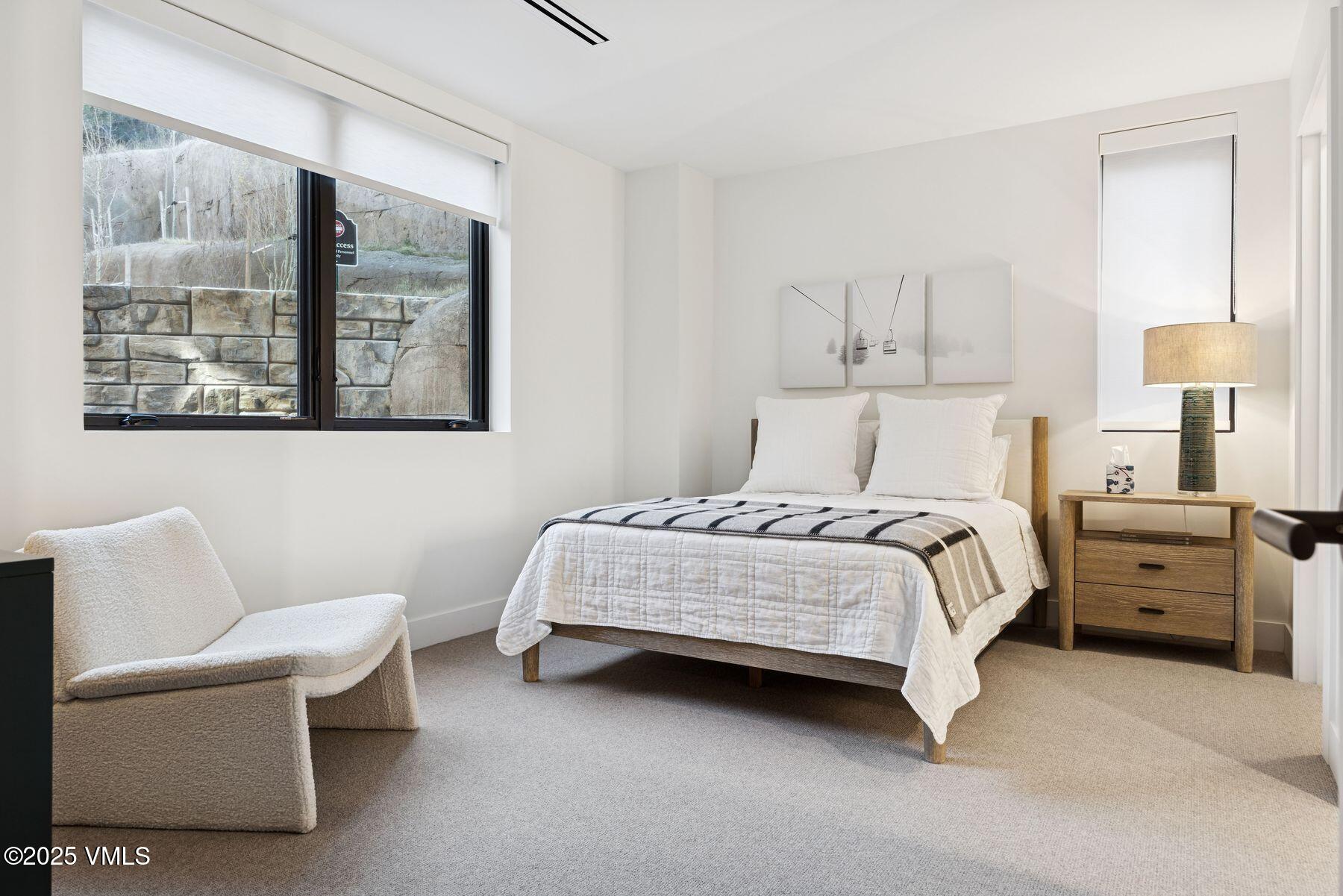 38460 Hwy 6 Avon Co 81620, Unit 205 Avon, CO 81620 - Photo 19 of 47 a bedroom with a bed and a couch