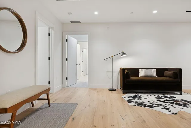 a bedroom with a bed and a mirror