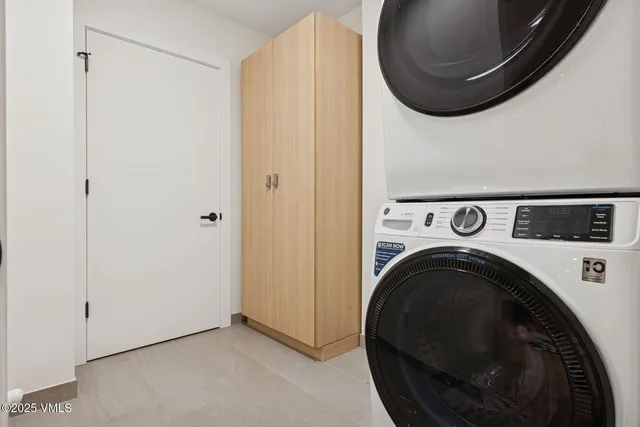a view of a hallway with washer and dryer