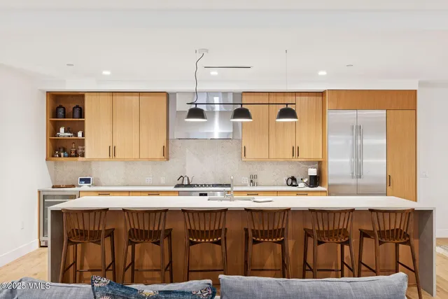 a kitchen with a sink a counter top space and cabinets