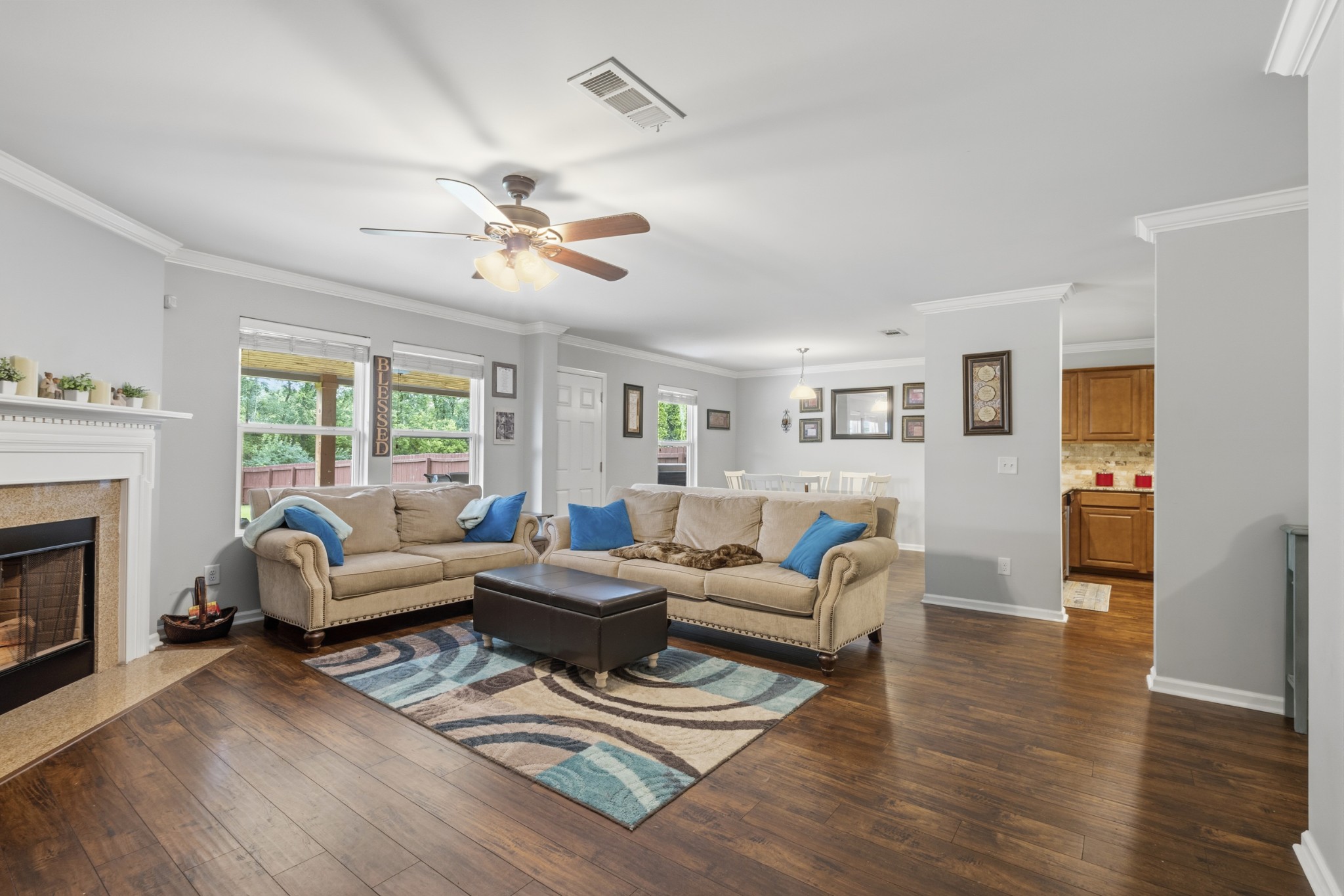 1011 Benwick Road Hendersonville, TN 37075 - Photo 19 of 60 a living room with furniture a fireplace and wooden floor