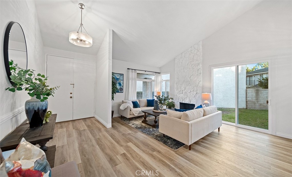 159 Los Alamitos Circle Placentia, CA 92870 - Photo 7 of 48 Vaulted Ceilings, Custom Light Fixtures, New windows & slider.