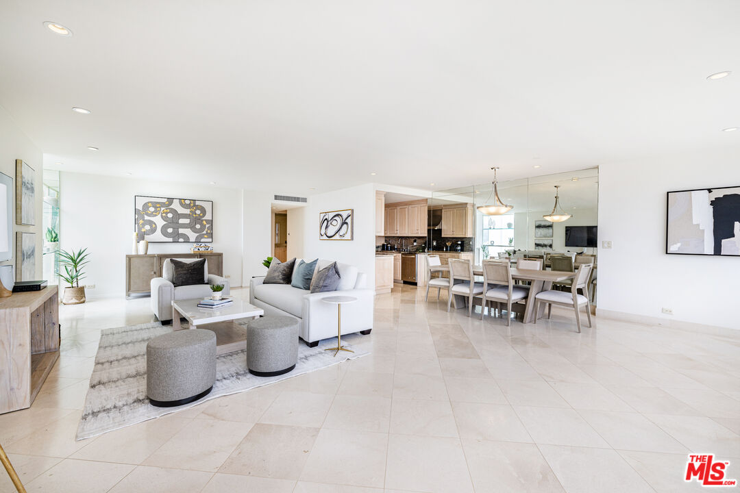 2220 Avenue Of The Stars, Unit 803 Los Angeles, CA 90067 - Photo 21 of 25 a living room with lots of furniture and white walls