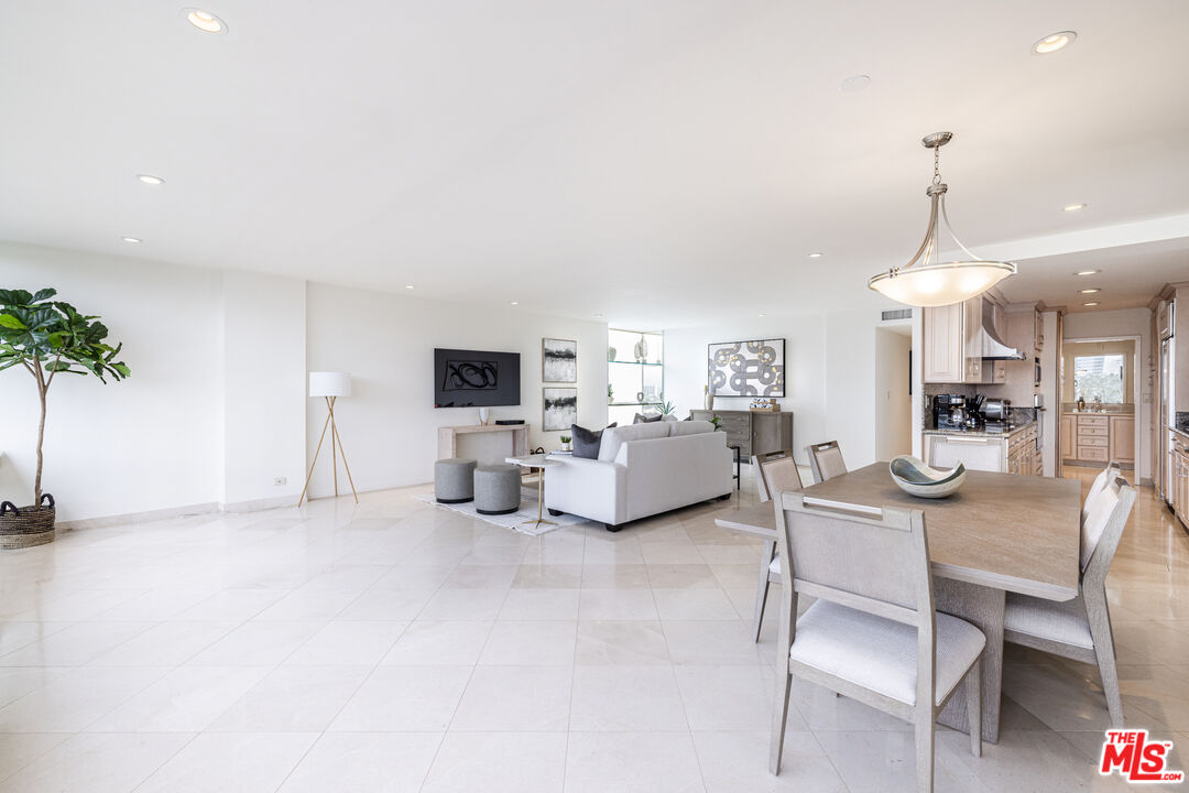 2220 Avenue Of The Stars, Unit 803 Los Angeles, CA 90067 - Photo 23 of 25 a living room with furniture and a chandelier