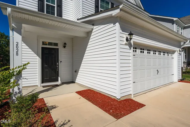 a view of a house with a door and pathway