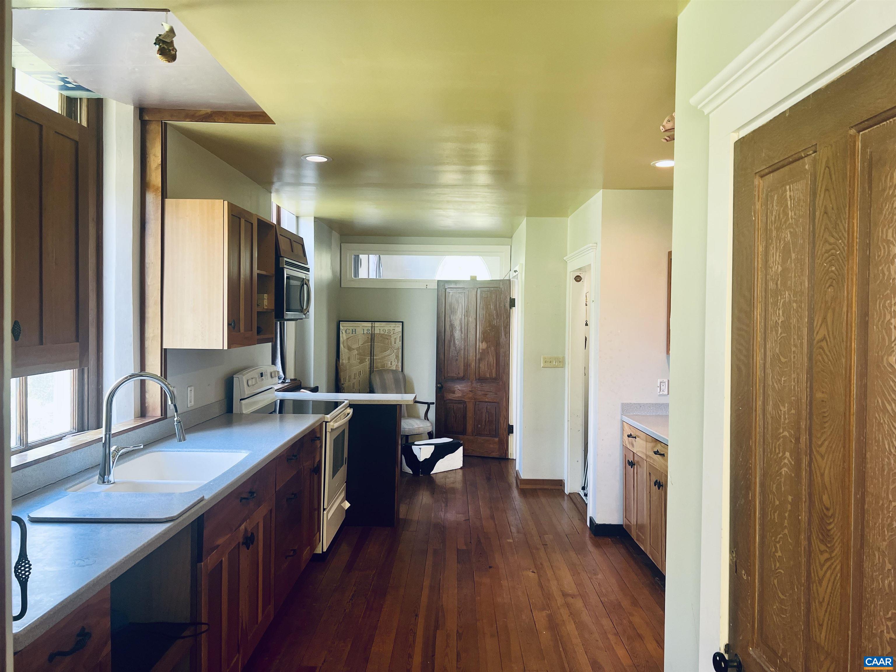 1105 Summerdean Road Middlebrook, VA 24459 - Photo 27 of 75 a bathroom with a granite countertop double vanity sink a mirror and a shower