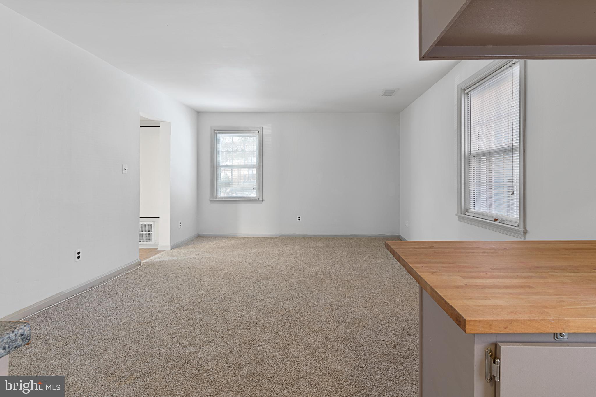 3800 V Street Southeast, Unit 101 Washington, DC 20020 - Photo 12 of 28 an empty room with windows