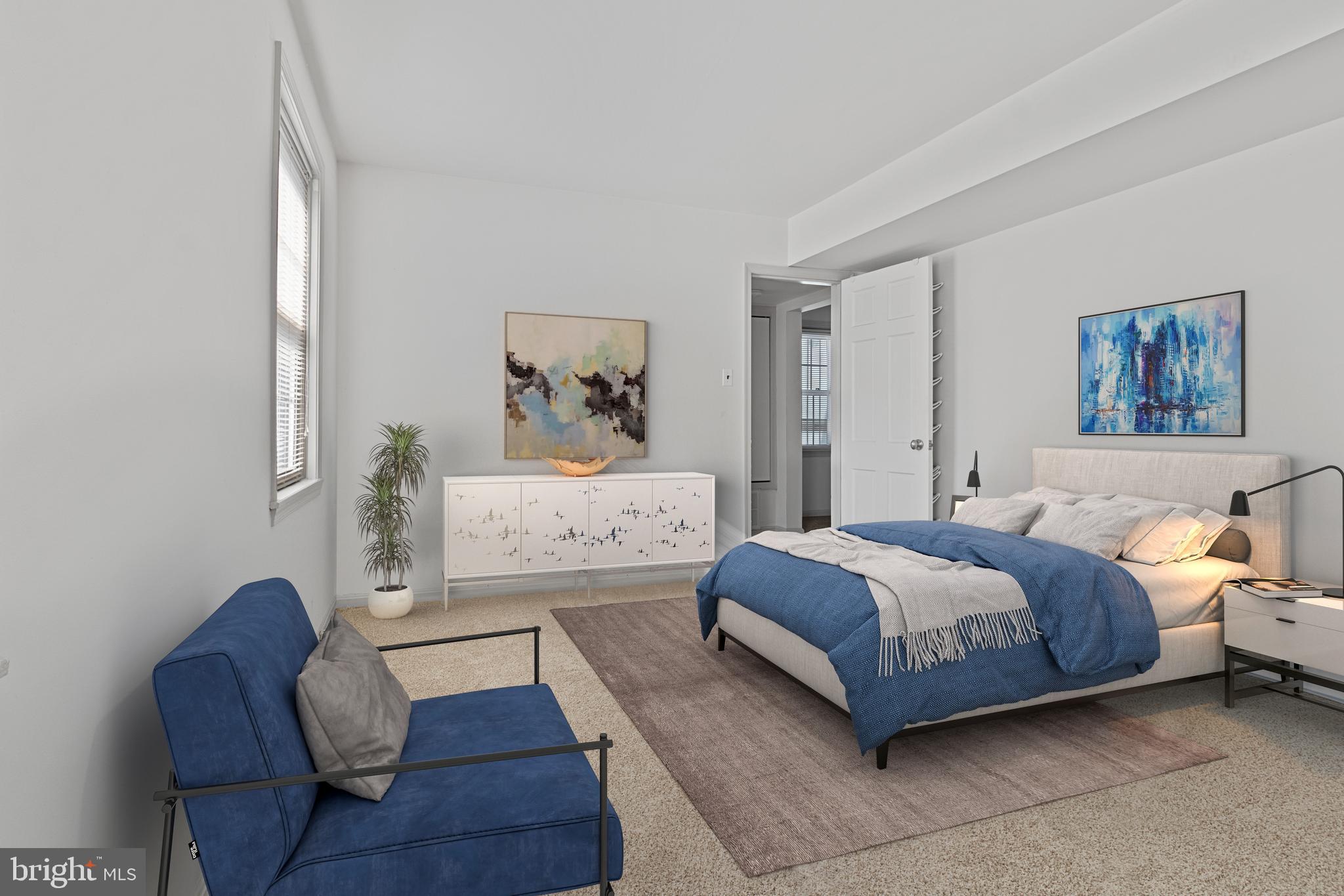 3800 V Street Southeast, Unit 101 Washington, DC 20020 - Photo 19 of 28 a bedroom with a bed and a couch