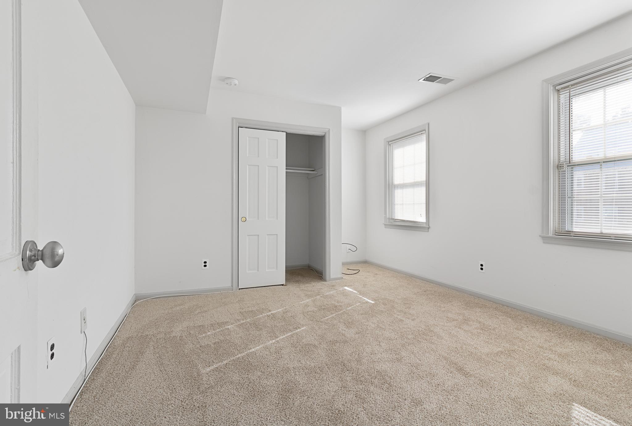 3800 V Street Southeast, Unit 101 Washington, DC 20020 - Photo 20 of 28 an empty room with windows