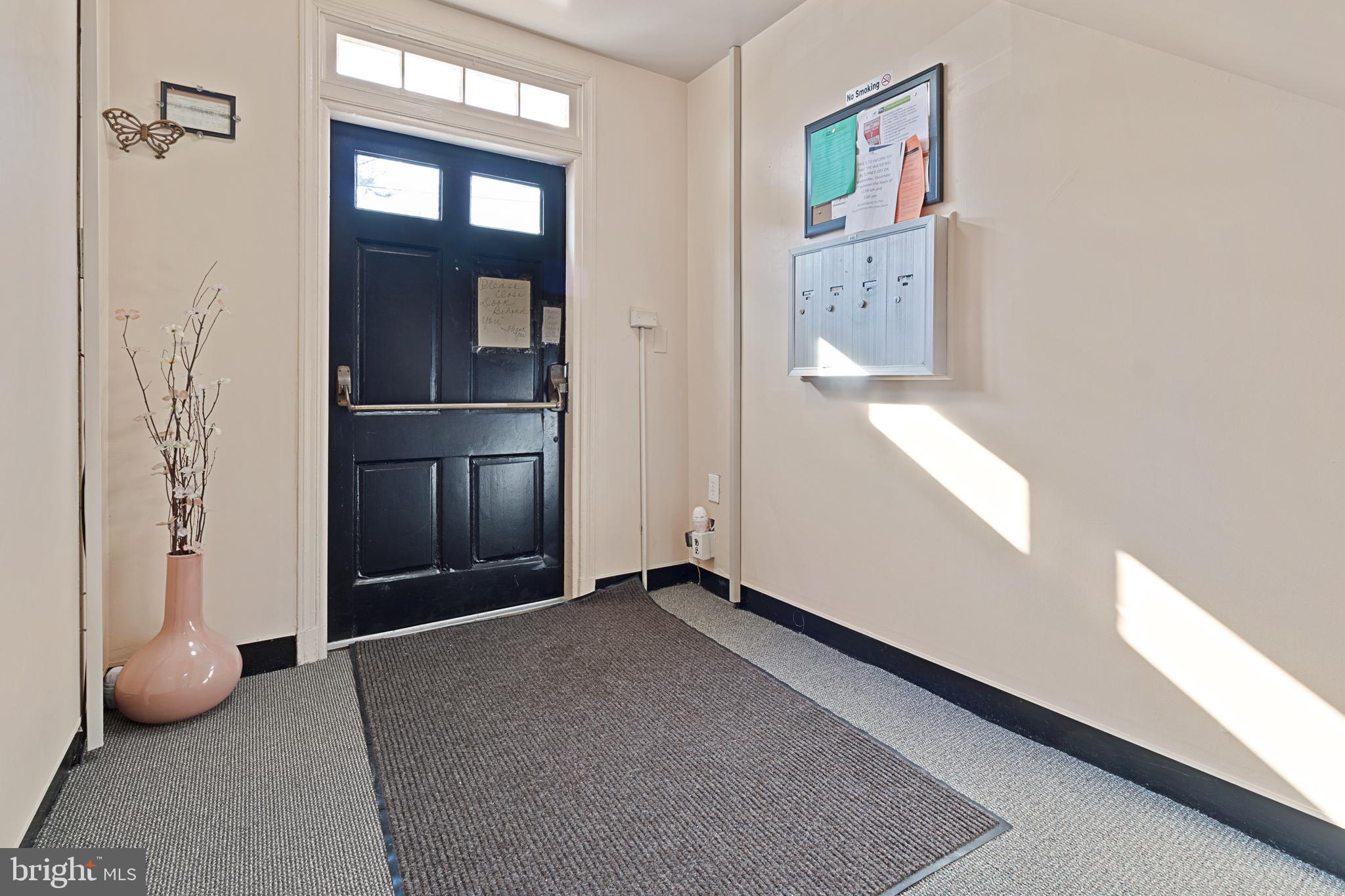 3800 V Street Southeast, Unit 101 Washington, DC 20020 - Photo 3 of 28 an empty room with windows
