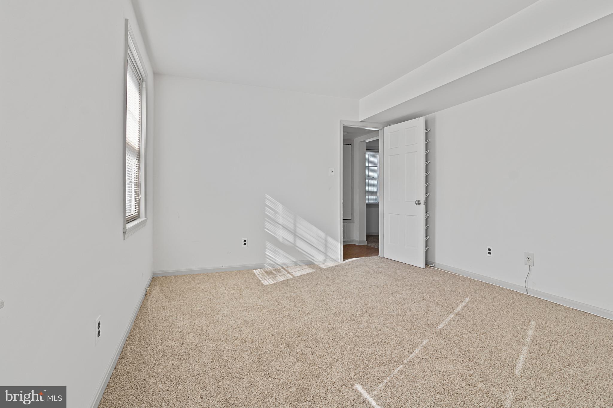 3800 V Street Southeast, Unit 101 Washington, DC 20020 - Photo 21 of 28 an empty room with a natural light