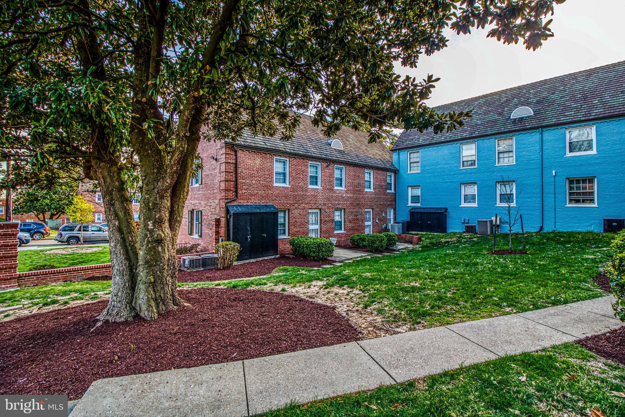 3800 V Street Southeast, Unit 101 Washington, DC 20020 - Photo 24 of 28 a front view of a house with garden