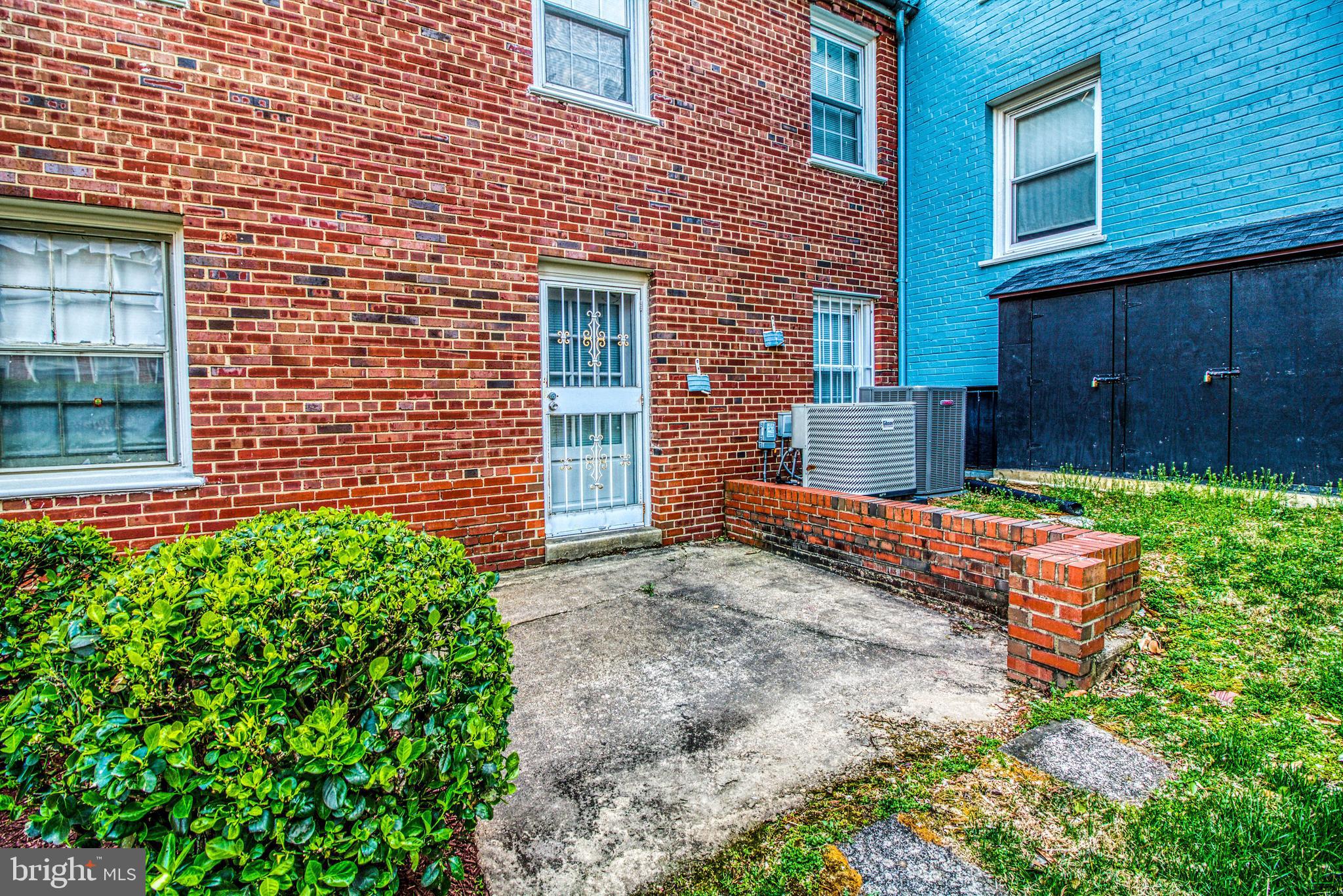 3800 V Street Southeast, Unit 101 Washington, DC 20020 - Photo 27 of 28 a view of a house with a yard and wooden fence