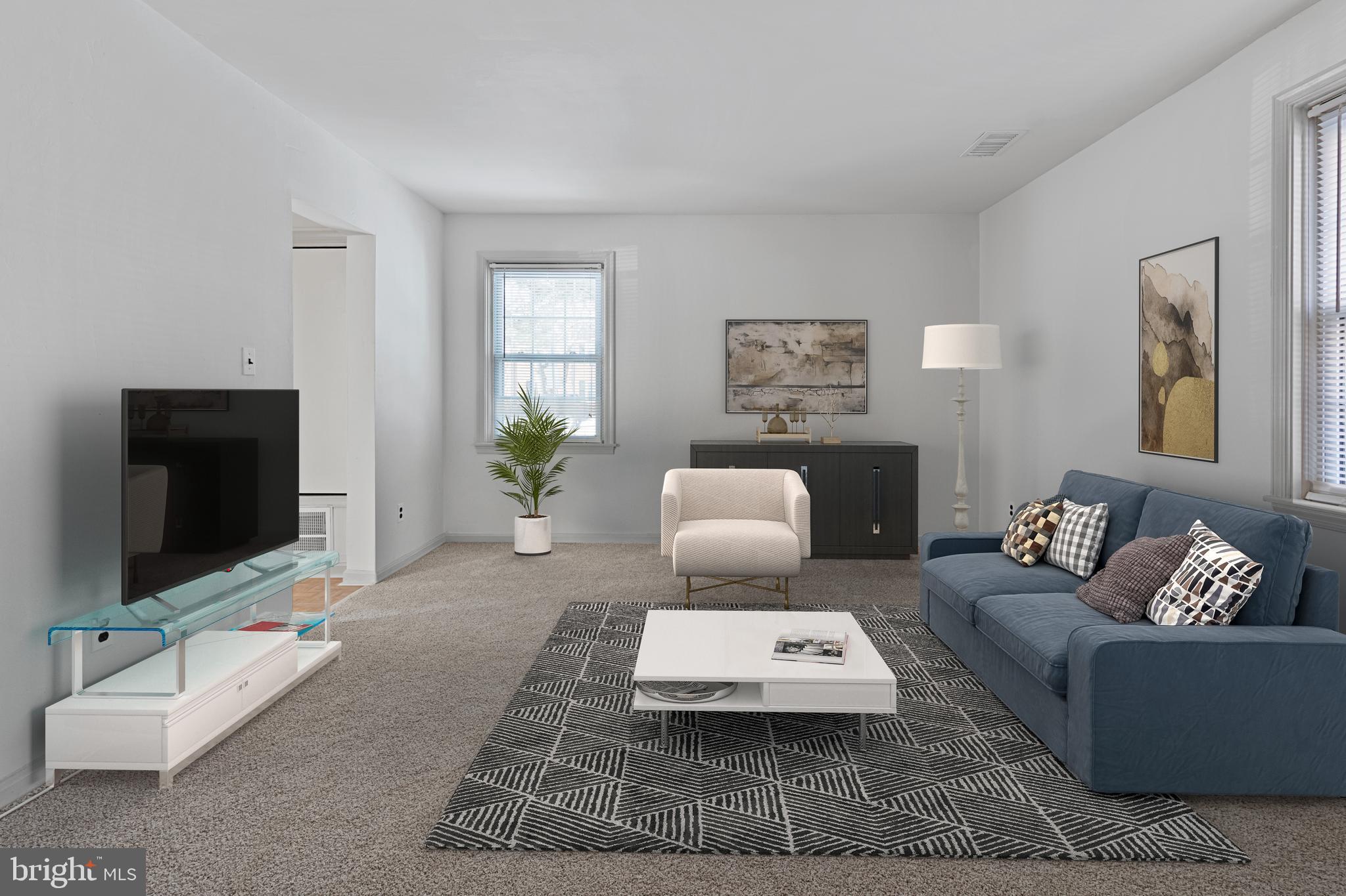 3800 V Street Southeast, Unit 101 Washington, DC 20020 - Photo 10 of 28 a living room with furniture and a flat screen tv