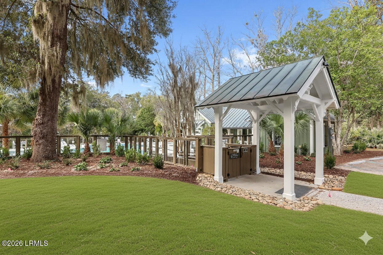 101 Barnaby Bluff Seabrook, SC 29940 - Photo 28 of 84 Edited Green grass to poolhouse entrance