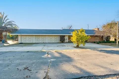 14721 East Tulare Avenue Sanger, CA 93657 - Photo 1 of 21 a view of a backyard of the house