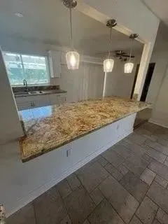 a view of a kitchen with a sink