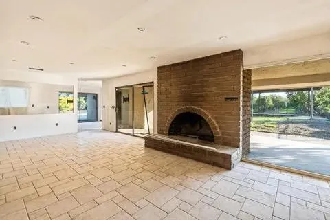 a large kitchen with cabinets and a stove