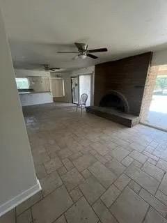 14721 East Tulare Avenue Sanger, CA 93657 - Photo 19 of 21 a view of empty room with wooden floor and fireplace