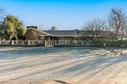 14721 East Tulare Avenue Sanger, CA 93657 - Photo 3 of 21 a view of a house with a yard