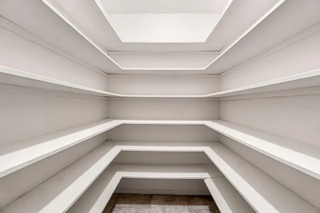 a bathroom with a double vanity sink and mirror