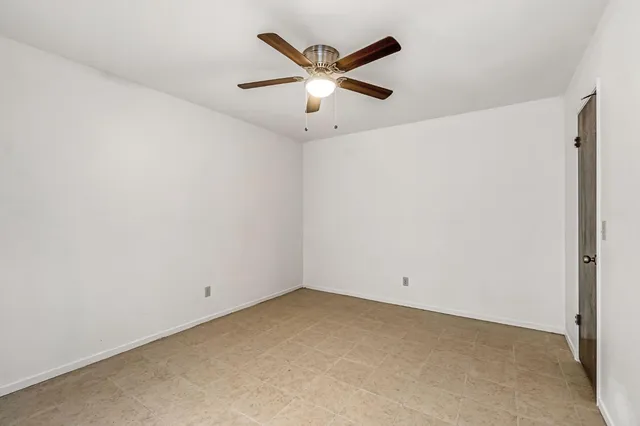 a view of a house with a big yard and potted plants