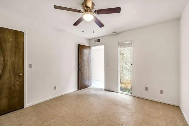 a view of a swimming pool with outdoor seating and plants