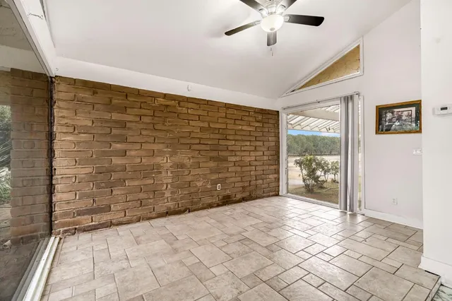 a very nice looking open kitchen with granite countertop a stove top oven a sink and dishwasher