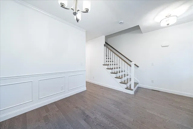 a view of an entryway with wooden floor