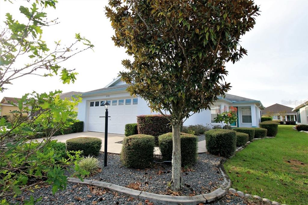 9791 Southwest 92nd Place Road Ocala, FL 34481 - Photo 1 of 1 a front view of a house with a yard