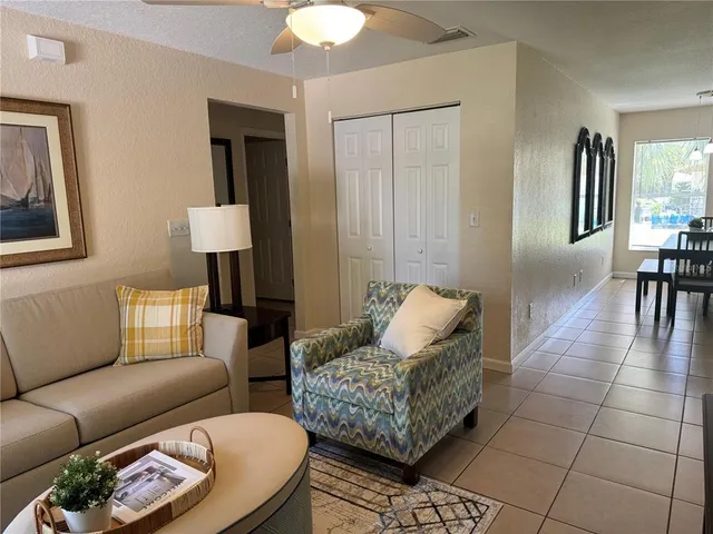a living room with furniture and a table