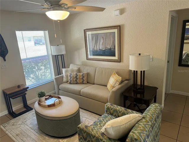 a living room with furniture and a window