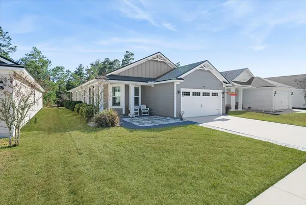 a view of a patio with table and chairs and potted plants