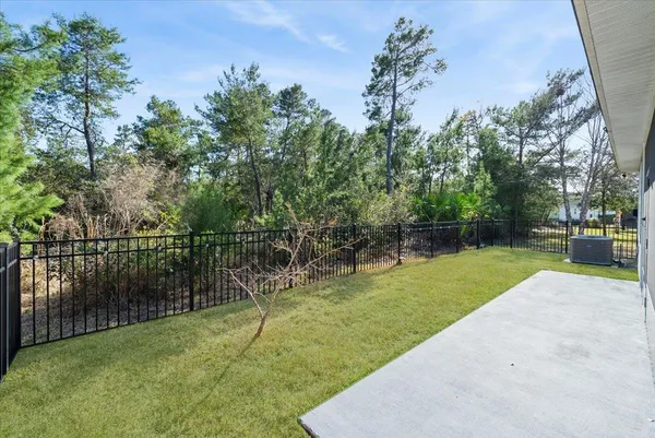 an aerial view of a house with a yard basket ball court and outdoor seating