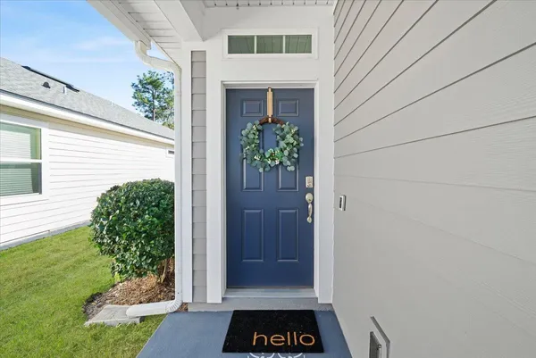 a bedroom with two beds and a chandelier