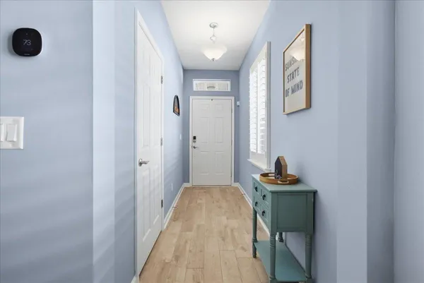 a large kitchen with kitchen island a sink table and chairs