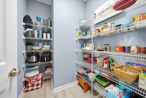 a kitchen with kitchen island a sink table and chairs