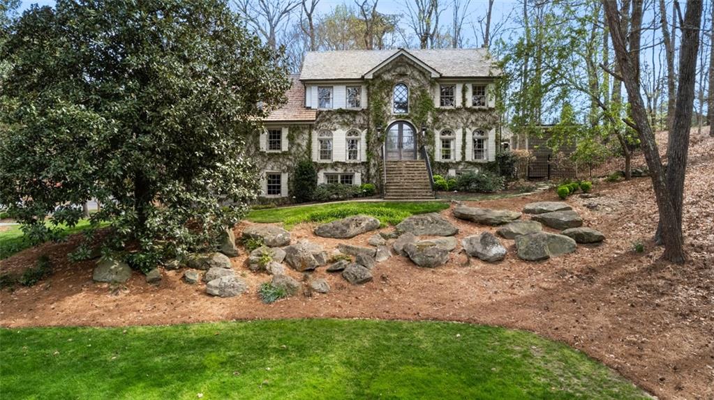 4524 Sentinel Post Road Northwest Atlanta, GA 30327 - Photo 1 of 1 front view of a house with a yard